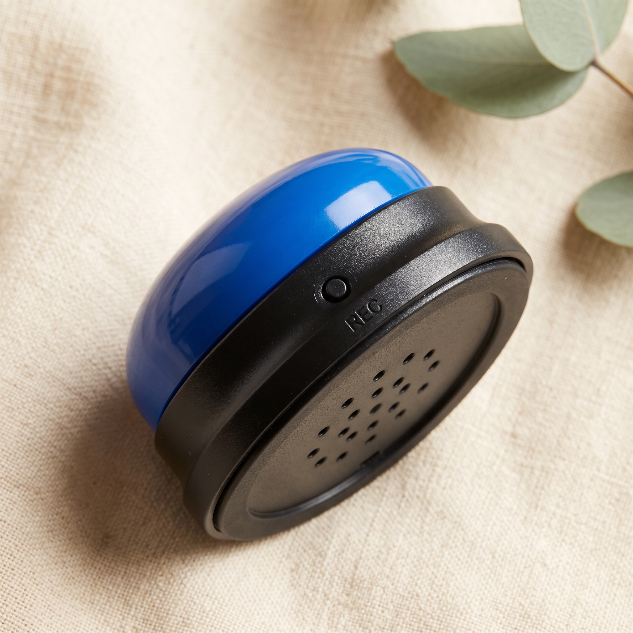 Close-up of Huddlepaw Talk Button showing the REC record button and speaker holes