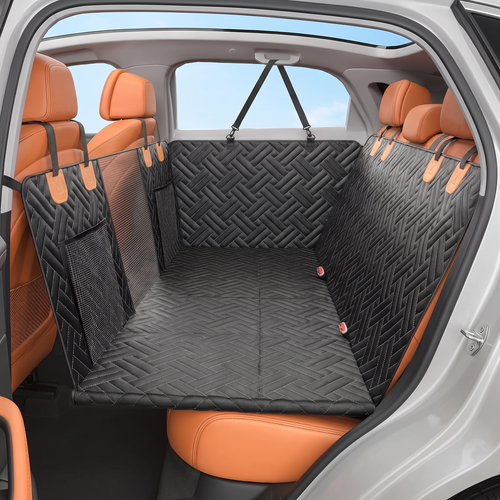 Huddlepaw hard-bottom back seat extender in black, installed across a car's rear seat